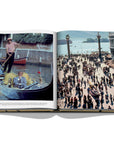 Assouline James Bond: Destinations coffee table book displaying photo of St. Mark's Square & Italy in the late 80’s at on a white background available at Spacio India for luxury home decor accessories collection of Travel Coffee Table Books.