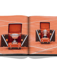 Assouline Louis Vuitton: Trophy Trunks coffee table book displaying photo of Louis Vuitton French Open Trophy Trunks 2017 on a white back ground available at Spacio India for luxury home decor accessories collection of Fashion Coffee Table Books.