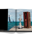 Assouline Louis Vuitton: Trophy Trunks coffee table book displaying image of The America's Cup case was handmade by the Maison's artisans on a white back ground available at Spacio India for luxury home decor accessories collection of Fashion Coffee Table Books.