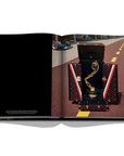 Assouline Louis Vuitton: Trophy Trunks coffee table book displaying image of F1 Monaco Trophy Louis Vuitton on a white back ground available at Spacio India for luxury home decor accessories collection of Fashion Coffee Table Books.