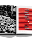 Assouline Montblanc coffee table book displaying vintage picture of Postal Worker & RED collection in collaboration with the (RED) foundation, 2019 available at Spacio India for luxury home decor accessories collection of Fashion Coffee Table Books.