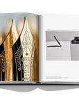 Assouline Montblanc coffee table book displaying picture of montblanc presents the rare art of gold nib craftsmanship for the michelangelo foundation available at Spacio India for luxury home decor accessories collection of Fashion Coffee Table Books.