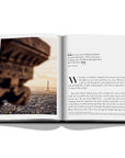 Assouline Paris Chic coffee table book displaying photo of distant view of Eiffel Tower with quote on white back ground available at Spacio India for luxury home decor accessories collection of Travel Coffee Table Books.