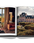 Assouline Paris Chic coffee table book displaying photos of Place des Vosges Museum & interior of apartment on white back ground available at Spacio India for luxury home decor accessories collection of Travel Coffee Table Books.