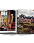 Assouline Paris Chic coffee table book displaying photos of Place des Vosges Museum & interior of apartment on white back ground available at Spacio India for luxury home decor accessories collection of Travel Coffee Table Books.