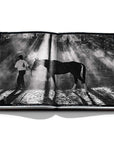 Assouline Polo Heritage Coffee Table Book displaying Photo clicked by photographer Aline Coquelle on a white back ground available at Spacio India for luxury home decor accessories collection of Sports Coffee Table Books.