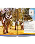 Assouline The Luxury Collection: Hotel Secrets coffee table book displaying photo of Ghaf Trees from Dubai on a white back ground available at Spacio India for luxury home decor accessories collection of Travel Coffee Table Books.