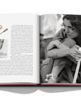 Assouline Cipullo: Making Jewelry Modern coffee table book displaying photo of Margaret Trudeau, Canadian Activist wearing jewellery on a coffee table available at Spacio India for luxury home decor collection of Jewellery Coffee Table Books.