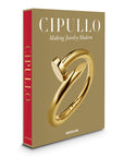 Side look of Assouline Cipullo: Making Jewelry Modern coffee table book on a white back ground available at Spacio India for luxury home decor collection of Jewellery Coffee Table Books.