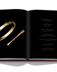 Assouline Cipullo: Making Jewelry Modern coffee table book displaying photo of one of the very first Love bracelets, formerly belonging to Cartier president Michael Thomas, who engaged Aldo Cipullo as a designer in 1969 on a white back ground available at Spacio India for luxury home decor collection of Jewellery Coffee Table Books.