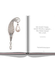 Assouline G Glenn: Spiro the art of a jewel coffee table book displaying photo of Glenn Spiro white pearl and diamond brooch with text quote on a white back ground available at Spacio India for luxury home decor collection of Jewellery Coffee Table Books.