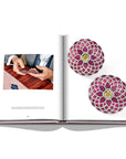 Assouline G Glenn: Spiro the art of a jewel coffee table book displaying photo of Glenn Spiro Mosaic Earrings in Titanium with Rubies, Yellow and White Diamonds on a white back ground available at Spacio India for luxury home decor collection of Jewellery Coffee Table Books.