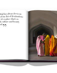 Assouline Jaipur Splendor coffee table book displaying photo of Women wearing Rajasthani traditional outfit in Jaipur on a white back ground available at Spacio India for luxury home decor accessories collection of Travel Coffee Table Books.