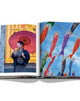 Assouline Tokyo Chic coffee table book page displaying an images of Japanese Carp Kites & Lady wearing Kimono with an umbrella on a white back ground available at Spacio India for luxury home decor accessories collection of Travel Coffee Table Books.