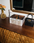 Assouline Tokyo Chic coffee table book with other Chic Series Books on a console with other accessories available at Spacio India for luxury home decor accessories collection of Travel Coffee Table Books.