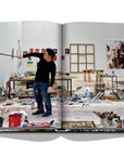 Assouline Tokyo Chic coffee table book page displaying Photo of Japanese Artist Yukimasa Ida clicked by Andrea Fazzari on a white back ground available at Spacio India for luxury home decor accessories collection of Travel Coffee Table Books.