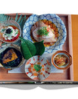 Assouline Tokyo Chic coffee table book page displaying Photo of Japanese Food clicked by Andrea Fazzari on a white back ground available at Spacio India for luxury home decor accessories collection of Travel Coffee Table Books.