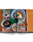 Assouline Tokyo Chic coffee table book page displaying Photo of Japanese Food clicked by Andrea Fazzari on a white back ground available at Spacio India for luxury home decor accessories collection of Travel Coffee Table Books.