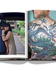 Assouline Tokyo Chic coffee table book page displaying Photos of The Japanese Couple & Man's Back covered with Tattoos clicked by Andrea Fazzari on a white back ground available at Spacio India for luxury home decor accessories collection of Travel Coffee Table Books.