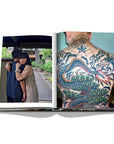 Assouline Tokyo Chic coffee table book page displaying Photos of The Japanese Couple & Man's Back covered with Tattoos clicked by Andrea Fazzari on a white back ground available at Spacio India for luxury home decor accessories collection of Travel Coffee Table Books.