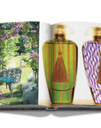 Assouline Venetian Chic coffee table book page picturing outdoor garden view & Flower fusions of 'Merchant of the Venice' on a white back ground available at Spacio India for luxury home decor accessories collection of Travel Coffee Table Books.