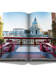 Assouline Venetian Chic coffee table book page picturing balcony restaurant view of Venice on a white back ground available at Spacio India for luxury home decor accessories collection of Travel Coffee Table Books.
