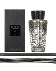 A Baobab Black Pearls Diffuser DIF500PB, filled with a fragrant ginger scent, is placed next to a box.