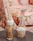 Baobab My First Baobab Women set of candle with diffuser on a coffee table in a pink theme interior available at Spacio India for luxury home decor collection of Gift Sets of Candles & Fragrance.