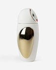 A white and gold Bosa Barns The Owl bottle from Manolo Bossi's Owls collection, placed on a white surface.