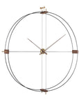 A Nomon Delmori G/F Black/A Walnut DEG000NN wall clock made of metal and wood.