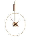 A Nomon Clock Nomon Micro Daro G Walnut MDADN hanging on a white wall in luxury interiors.