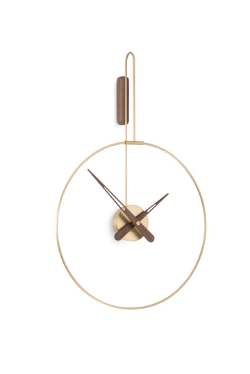 A Nomon Clock Nomon Micro Daro G Walnut MDADN hanging on a white wall in luxury interiors.
