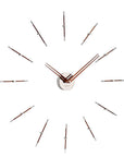 A Nomon minimalist wall clock with a circular pattern on a white background.