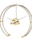 A sleek gold and brass Clock Nomon Omega G OMG with a professional style, featuring a circular shape.