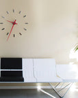 Nomon Spain Tacon L 12 Red on a wall above modern Sofa available at Spacio India for luxury home decor collection of Timepieces & Clocks.