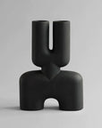 A hand glazed 101Cph Cobra Double Medio Coffee 211037 vase with a quirky curved shape, perfect for any interior setting.