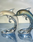 Set of Dolphin Baby On The Wave crystal centerpieces in white-gold and ocean-blue by Duccio Di Segna – luxury decor collectibles at Spacio India.