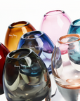 Collection of Henry Dean hand blown glass vases in various colours – Premium Belgian glassware available at Spacio India for luxury home styling.