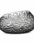 A grey crystal bowl with an intricate, faceted starburst pattern throughout, set against a plain white background.