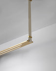 The Esperia Eridania Horizontal Suspension Light is a high-end decorative lighting fixture hanging from the ceiling in a room.