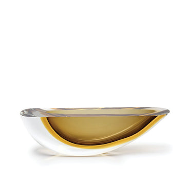 A Gardeco Glass Bowl with a Yellow Rim on a White Surface, perfect for displaying elegant candles and creating a sophisticated ambiance with a touch of Fume Amber.