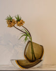 An elegant flower arrangement in a Gardeco Cance 160 Fume Amber vase.