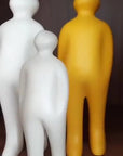 Three Gardeco Ceramic Sculpture Visitor Plus Yellow Acafrao Clear Cor36 sculptures displayed on a shelf.