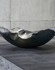 A Gardeco Mapa 30 Prata Fosca Top Platina on a concrete surface exudes luxury available at Spacio India for luxury home decor accessories collection of Decorative Bowls.