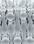 The Italamp Crowns Chandelier, from the Italamp brand, features a stunning row of clear glass rods that illuminate any space with a touch of elegance.