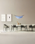 A modern dining room with an Italamp Dali pendant light and an Italamp table with chairs.