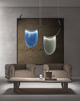 Two Italamp Dali thermoformed glass pendant lights, including an Italamp Dali chandelier, adorning a living room.