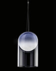 A Italamp Muna pendant light hanging from a black ceiling.