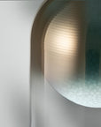 An Italamp Muna pendant lamp with a blue and gold shade.