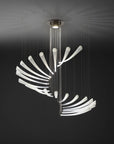 An Italamp Pulsa Spira, a contemporary chandelier providing illumination, crafted with blown glass, is suspended from the ceiling.